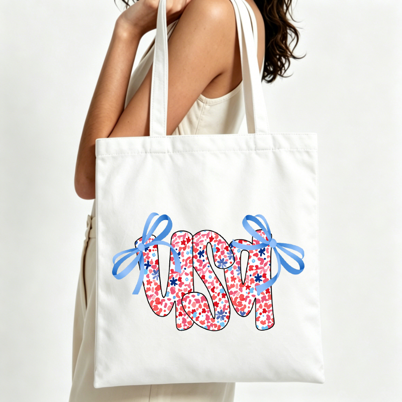 Women Bags Usa - กระเป๋าผ้าแคนวาสพิมพ์ลายตัวอักษรแบบอเมริกัน พร้อมดีเทลโบว์ เหมาะสำหรับการออกนอกบ้านในฤดูร้อนแบบสบายๆ และการช้อปปิ้งประจำวัน